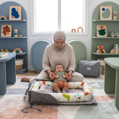 Haven baby support nest, colorful dinosaurs, nursery lifestyle