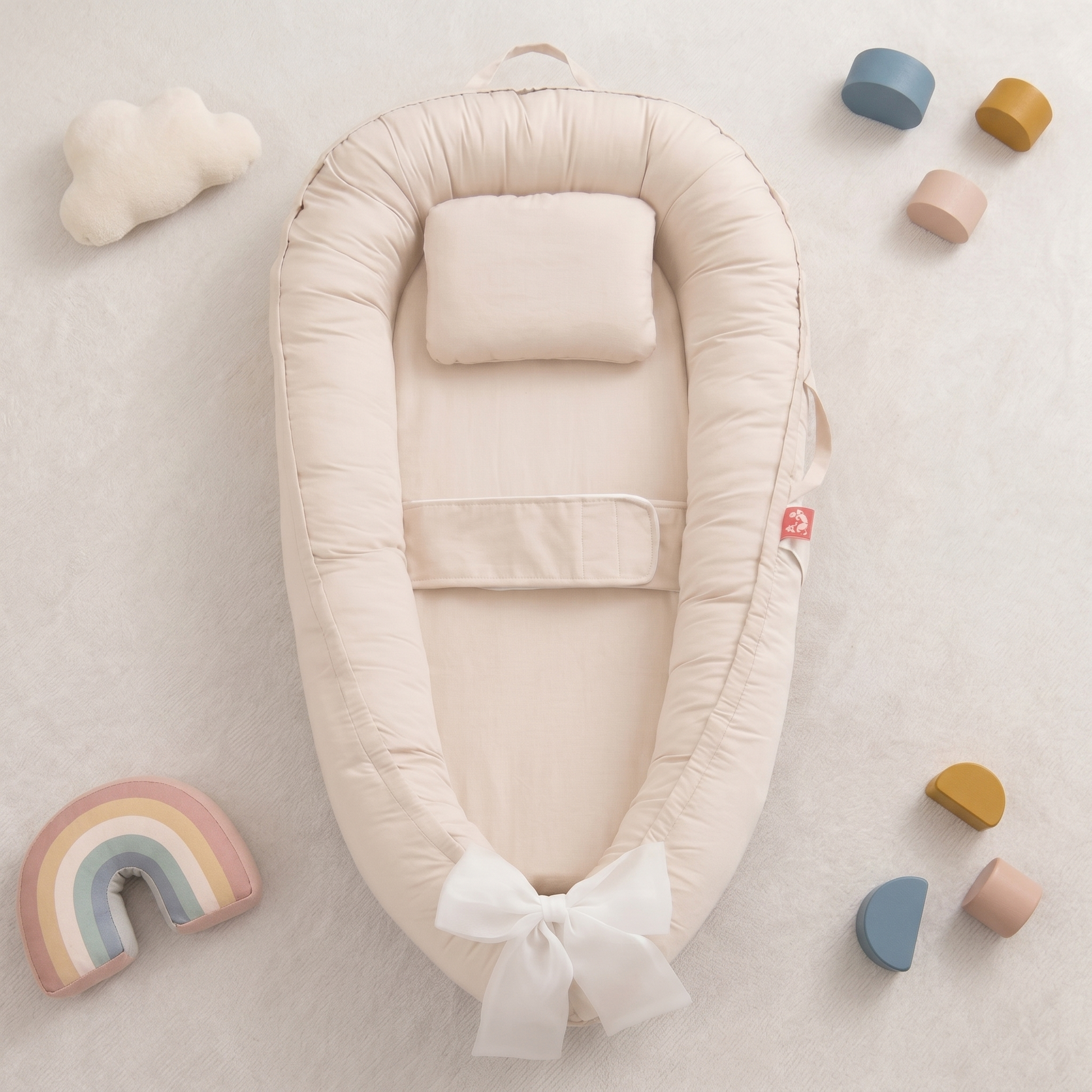 Halo winged baby nest, beige, styled flat lay